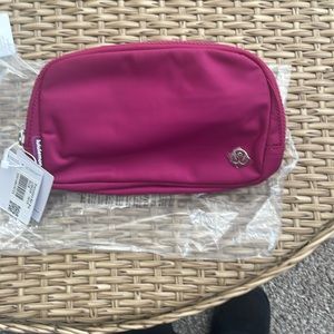 Brand new Lululemon belt bag in wild berry 1L